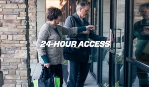 male and female entering front doors to gym