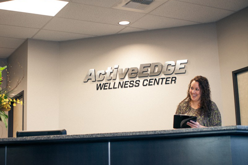female at reception desk for physical therapy business
