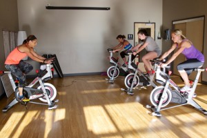 people in group cycling class