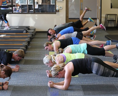 People performing plank exercise
